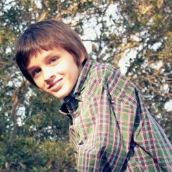 10 year old boy playing in tree