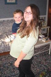 Pregnant mom holding son