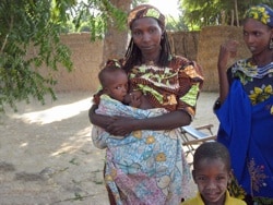 African woman breastfeeding baby