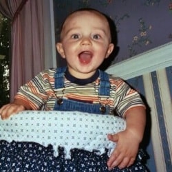 Baby boy in playpen