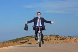 Businessman riding bike