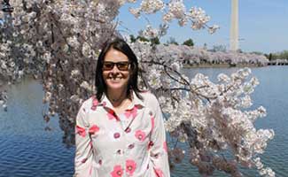 Sadie Cornelius writer for Earth's Friends Sadie Cornelius with cherry blossoms