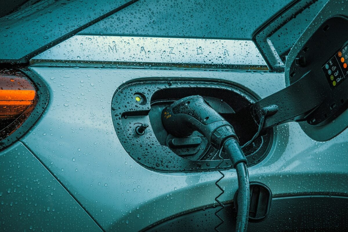 Closeup of charging electric vehicle.
