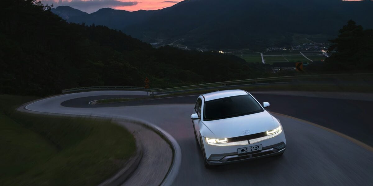 The front view of the Hyundai IONIQ 5 driving up a mountain.