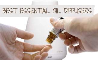 Essential oil being applied ot finger in front of diffuser