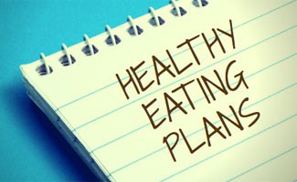 Healthy eating plan written on notebook