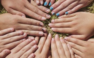 Kids hands in a circle
