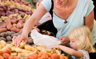 Mother and kid at farmer's market